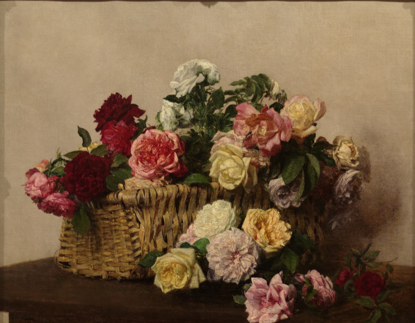 Henri Fantin-Latour, A Basket of Roses, 1885: a wicker basket overflowing with red, pink, yellow and white roses on a table against a dark brown background
